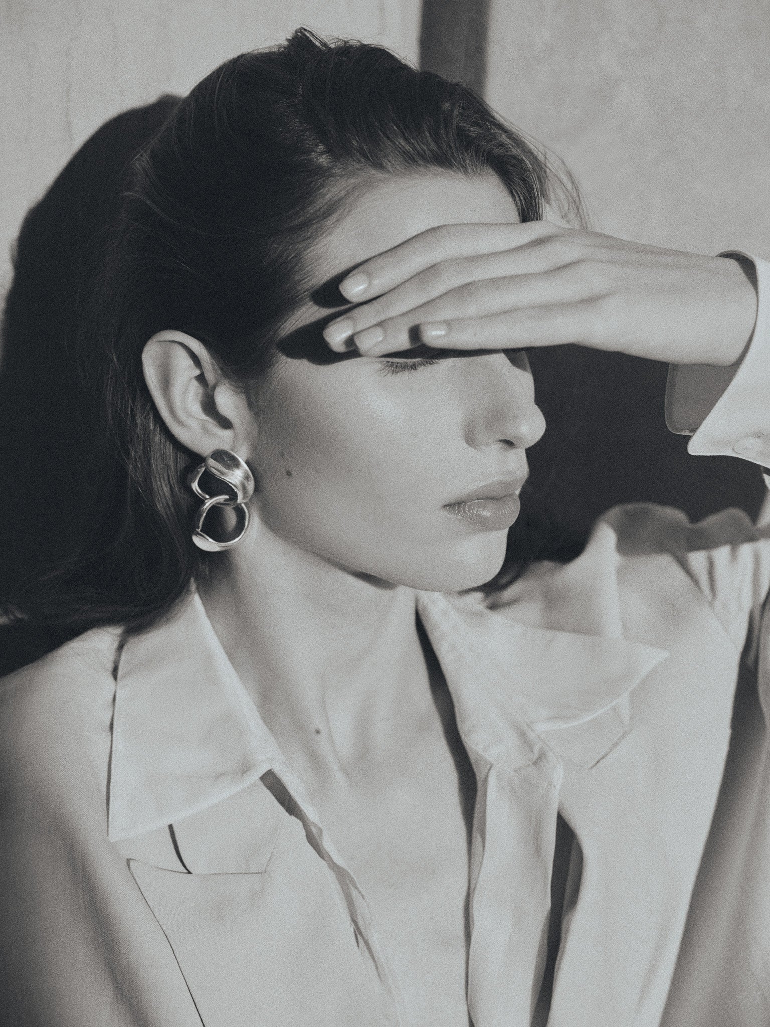 woman wearing AGMES 0.925 sterling silver long hoop Marta earrings