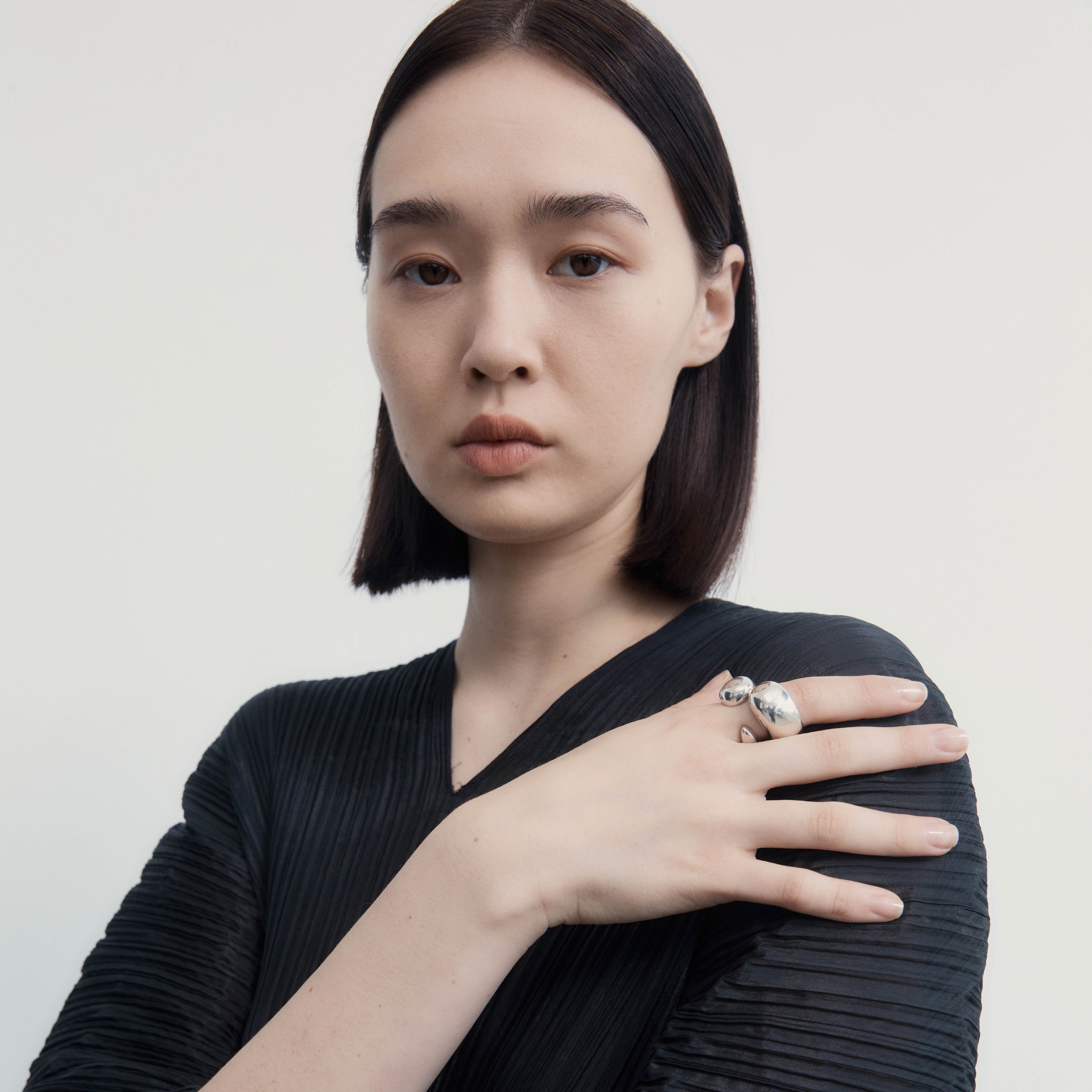 Woman wearing AGMES .925 Sterling Silver Sienna Ring Set of two. 