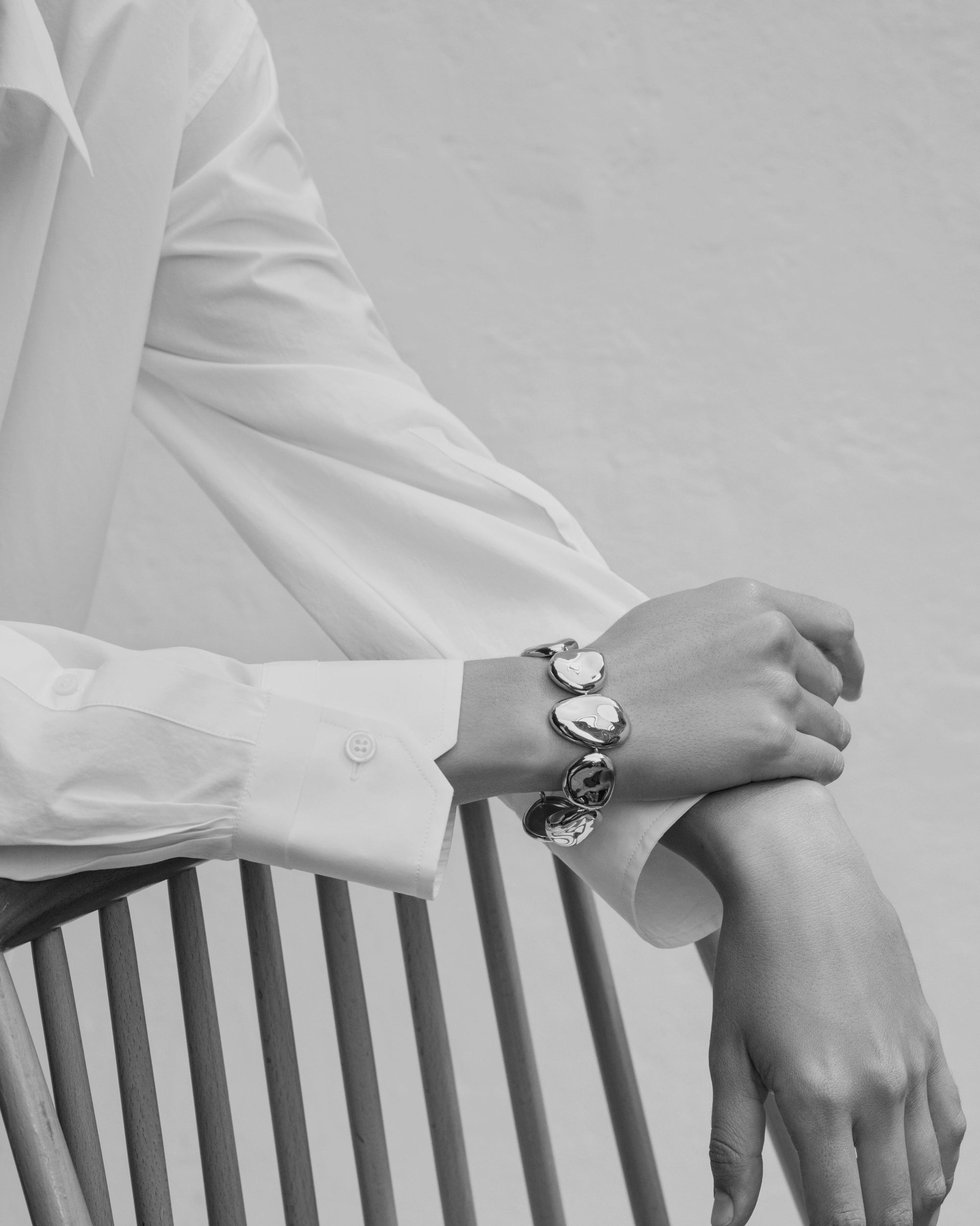 Woman wearing AGMES 0.925 sterling silver Conie Bracelet. 