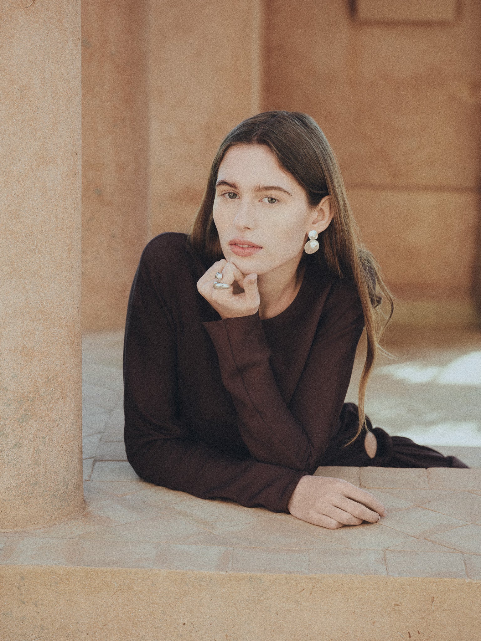 Woman wearing AGMES 0.925 sterling silver short circular round drop earrings.