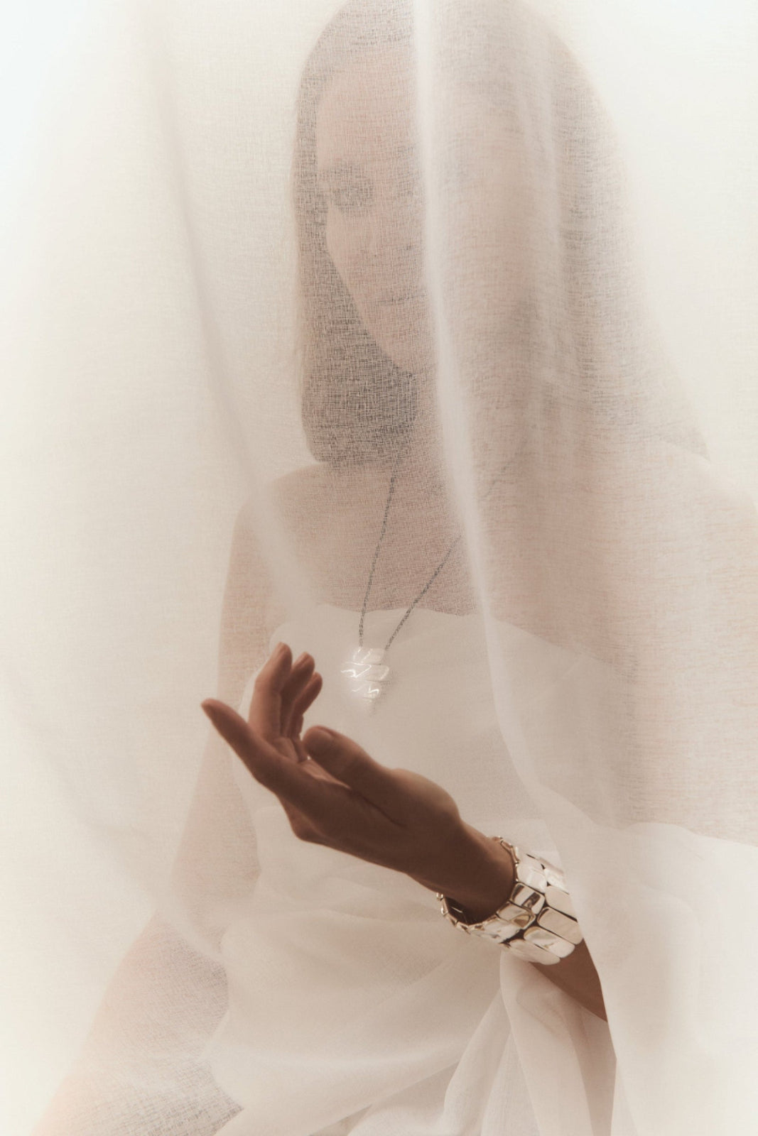 Woman wearing AGMES 0.925 sterling silver Ilona Bracelet with adjustable elastic band.