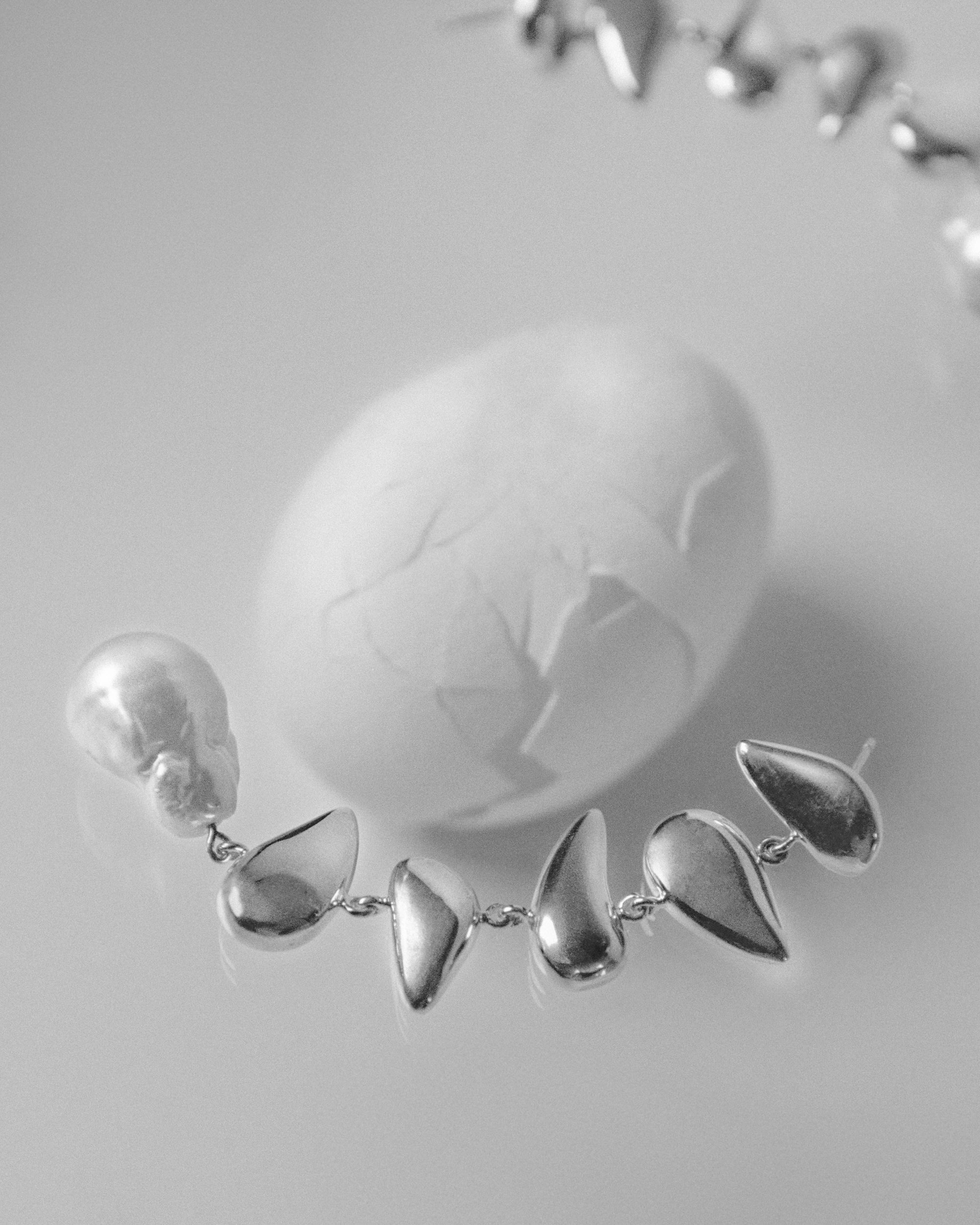 AGMES 0.925 sterling silver long drop pearl Flora earrings.