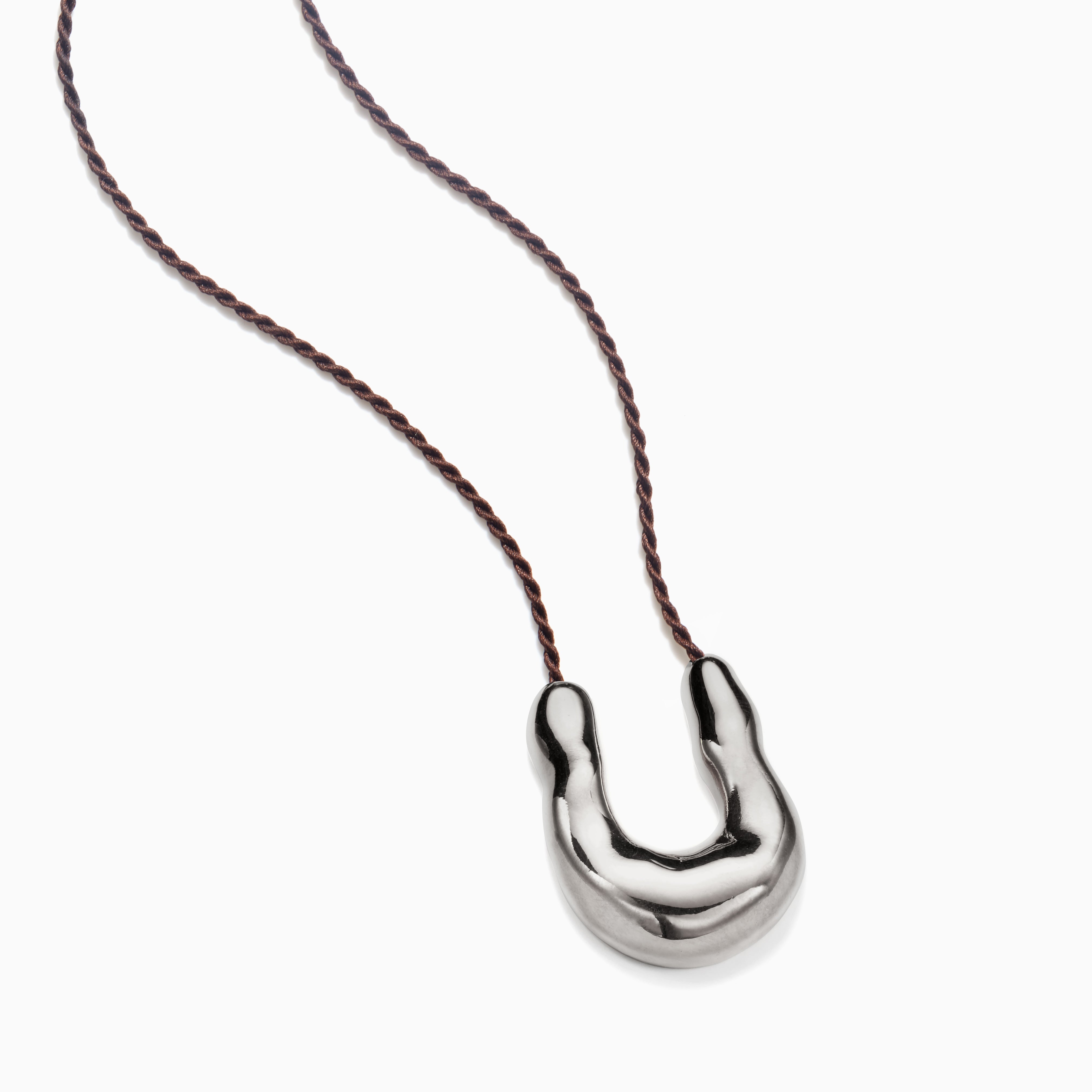 AGMES 0.925 sterling silver wishbone pendant on chocolate silk cord.