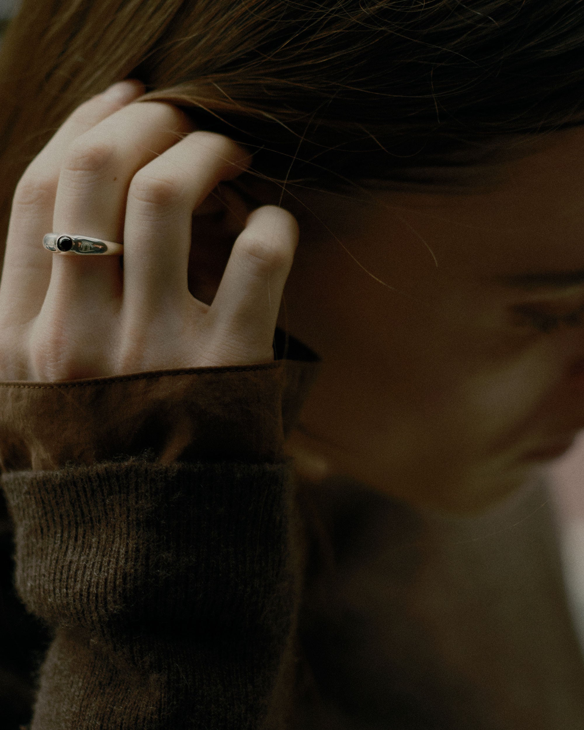 Model wearing .925 sterling silver AGMES cara ring with onyx stone