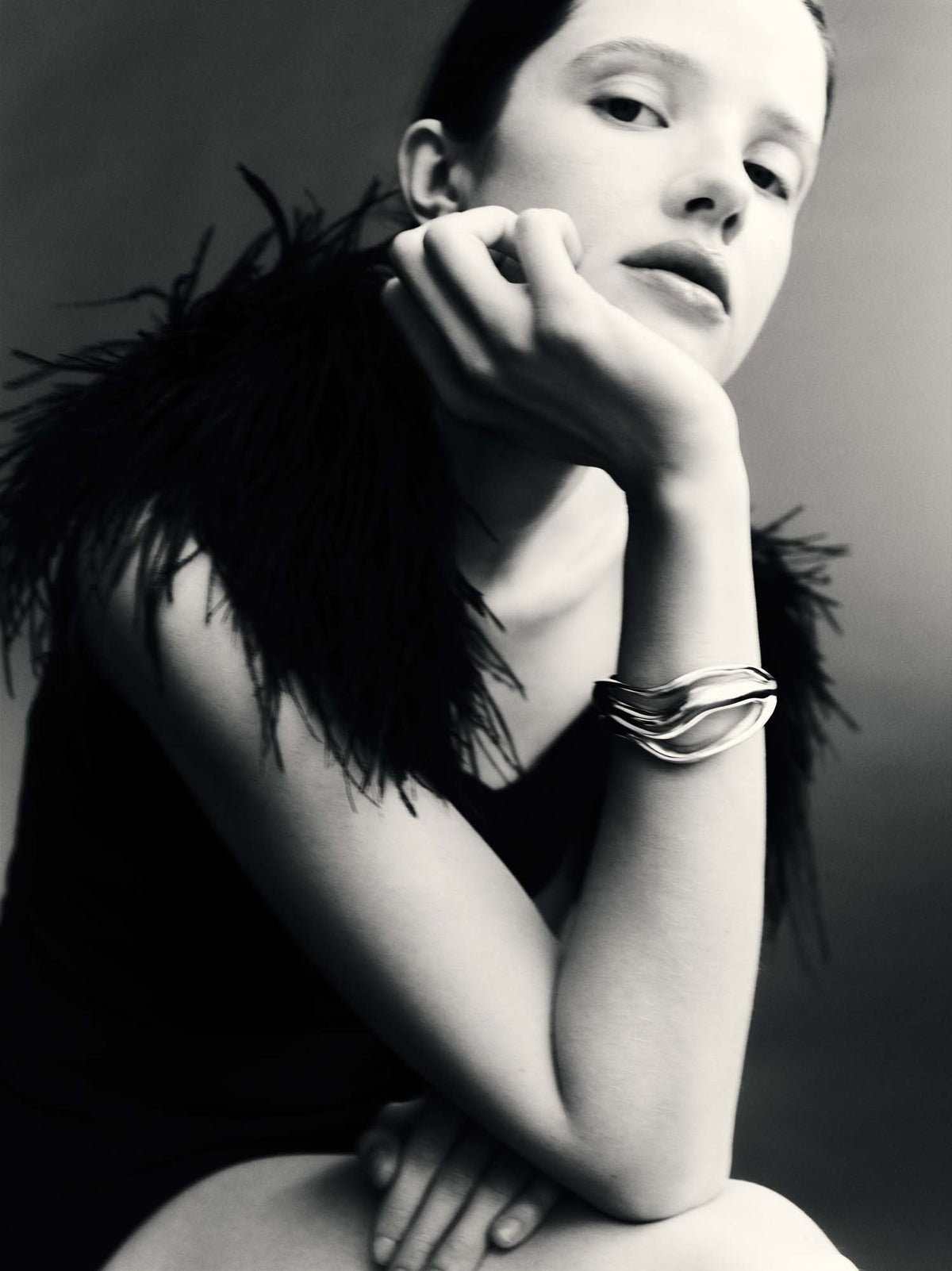 Model wearing .925 sterling silver anika cuff bracelet with 3-tiered open design, black and white 