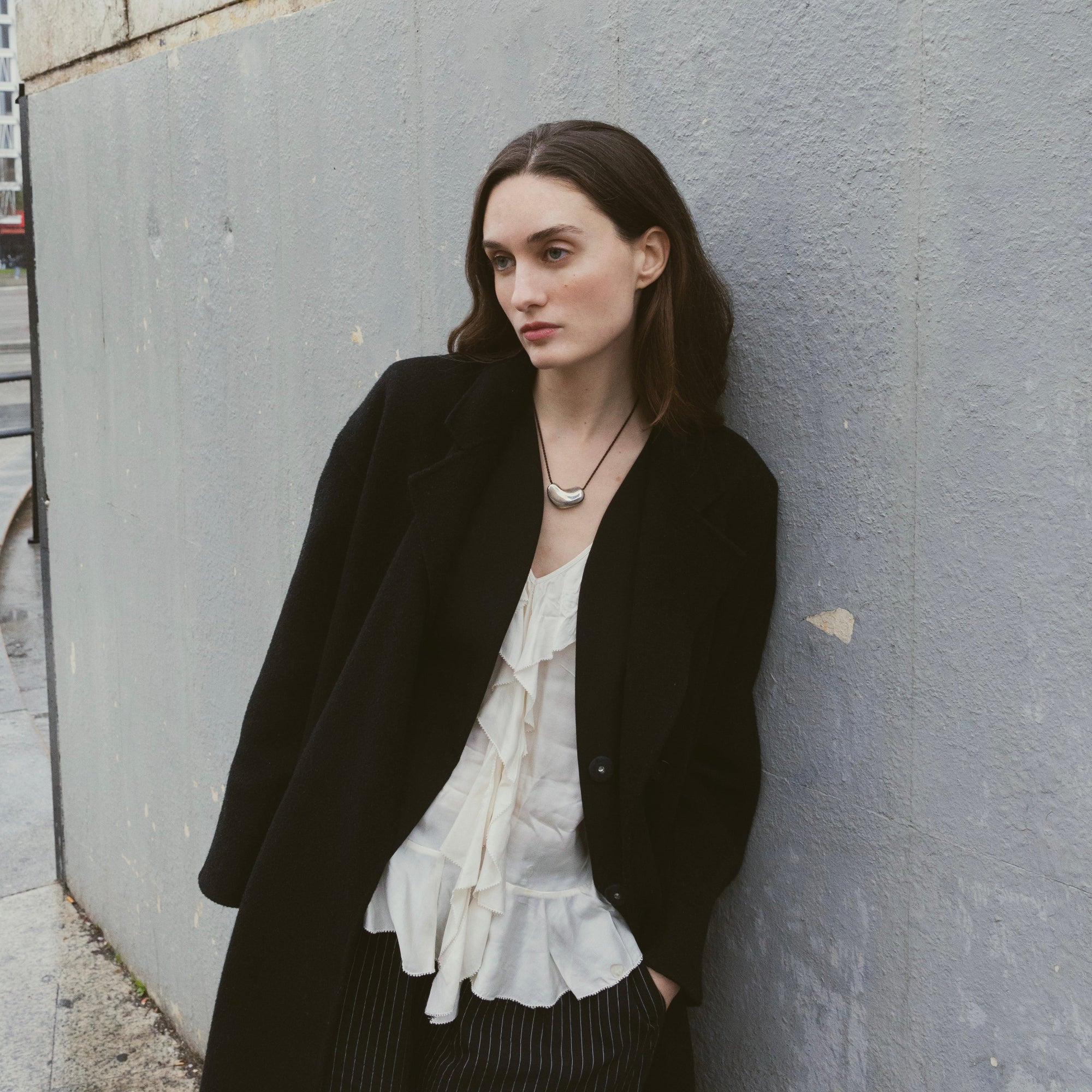 silver sculpted heart pendant on model