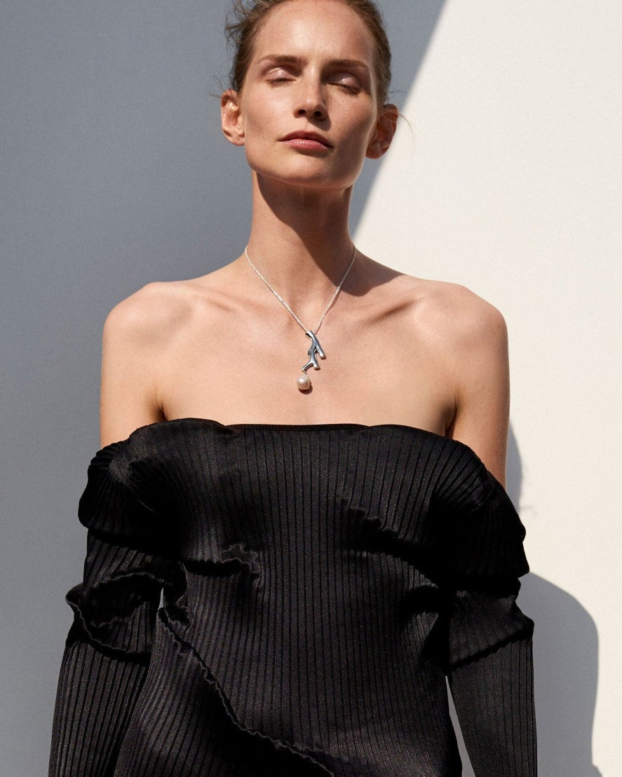 Woman wearing AGMES 0.925 sterling silver Coral drop Pendant with baroque freshwater pearl. 