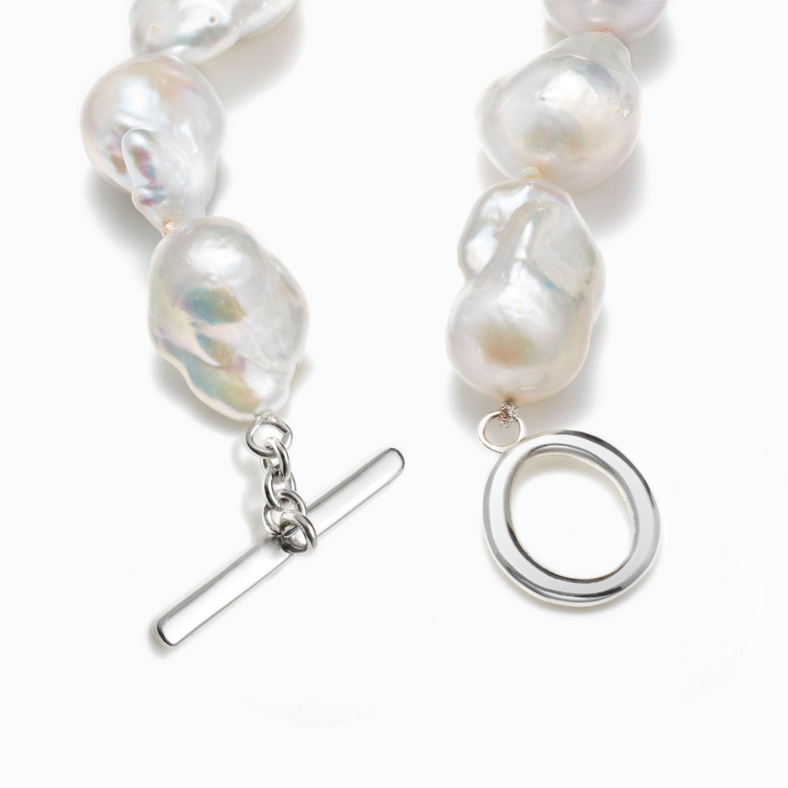 AGMES .925 sterling silver and freshwater Baroque Pearl Bracelet on white background.