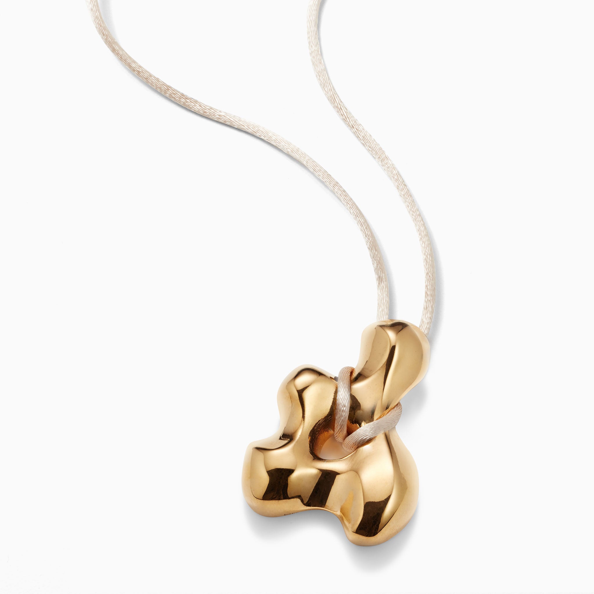 AGMES 18k Gold Vermeil sculpted pendant on Ivory satin cord. Simone Bodmer-Turner.