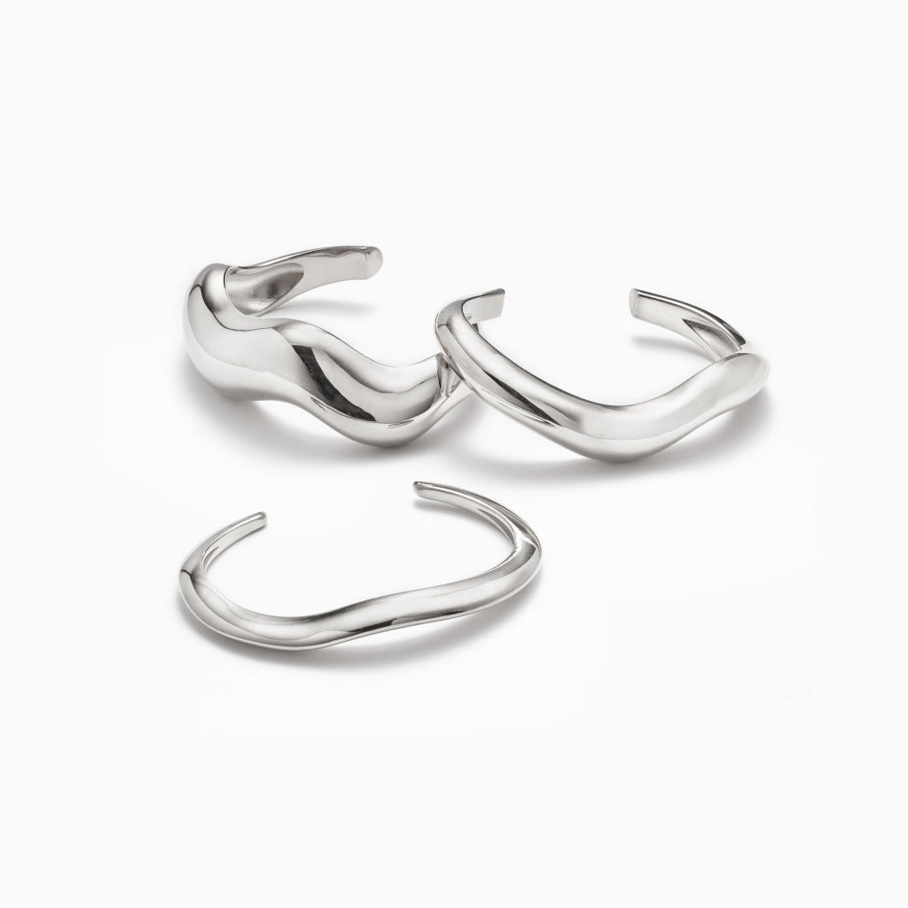 AGMES 0.925 sterling silver sculpted small, medium, and large Astrid cuff set on white background.