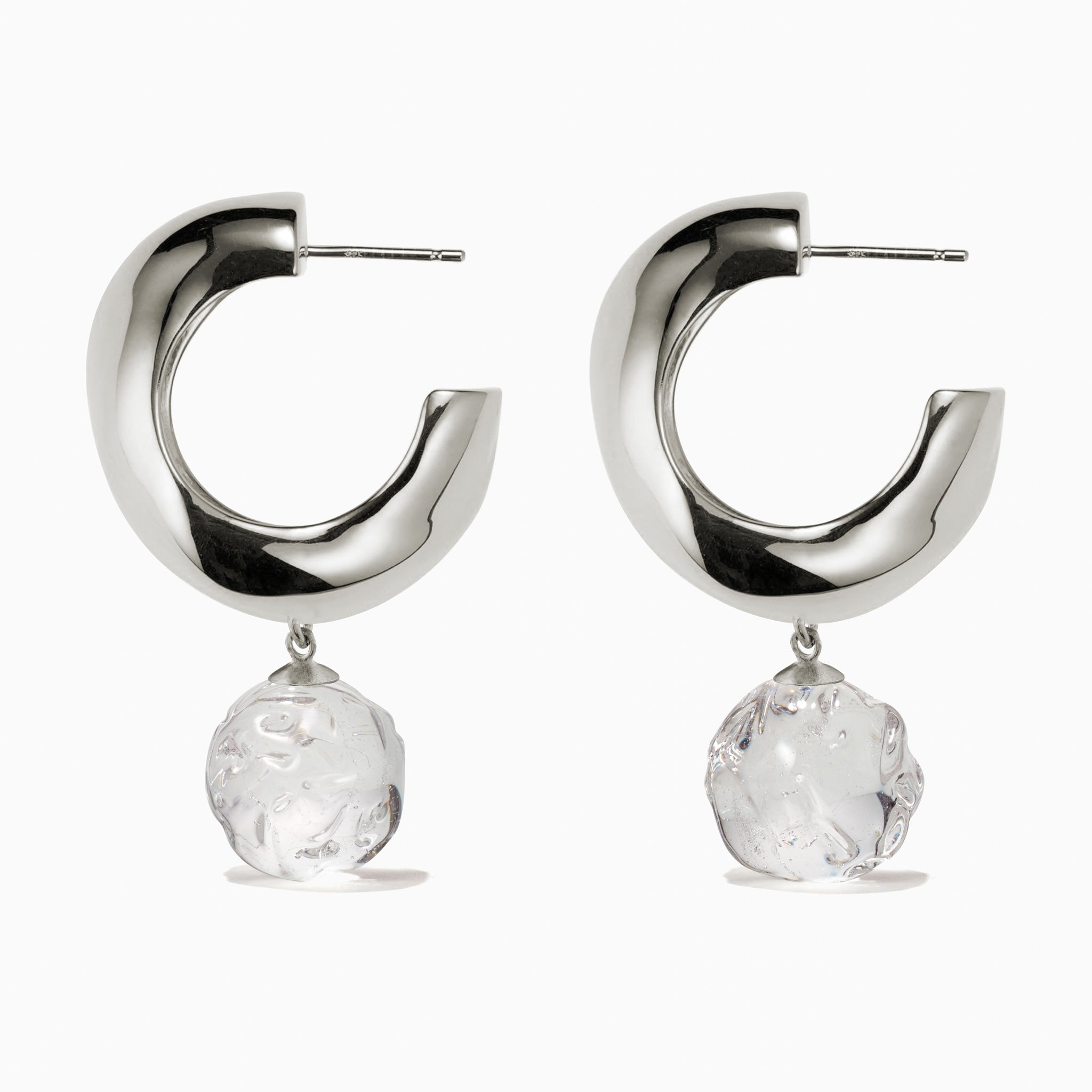 AGMES 0.925 sterling silver medium Cleo hoop earrings with clear glass bead drop on white background.