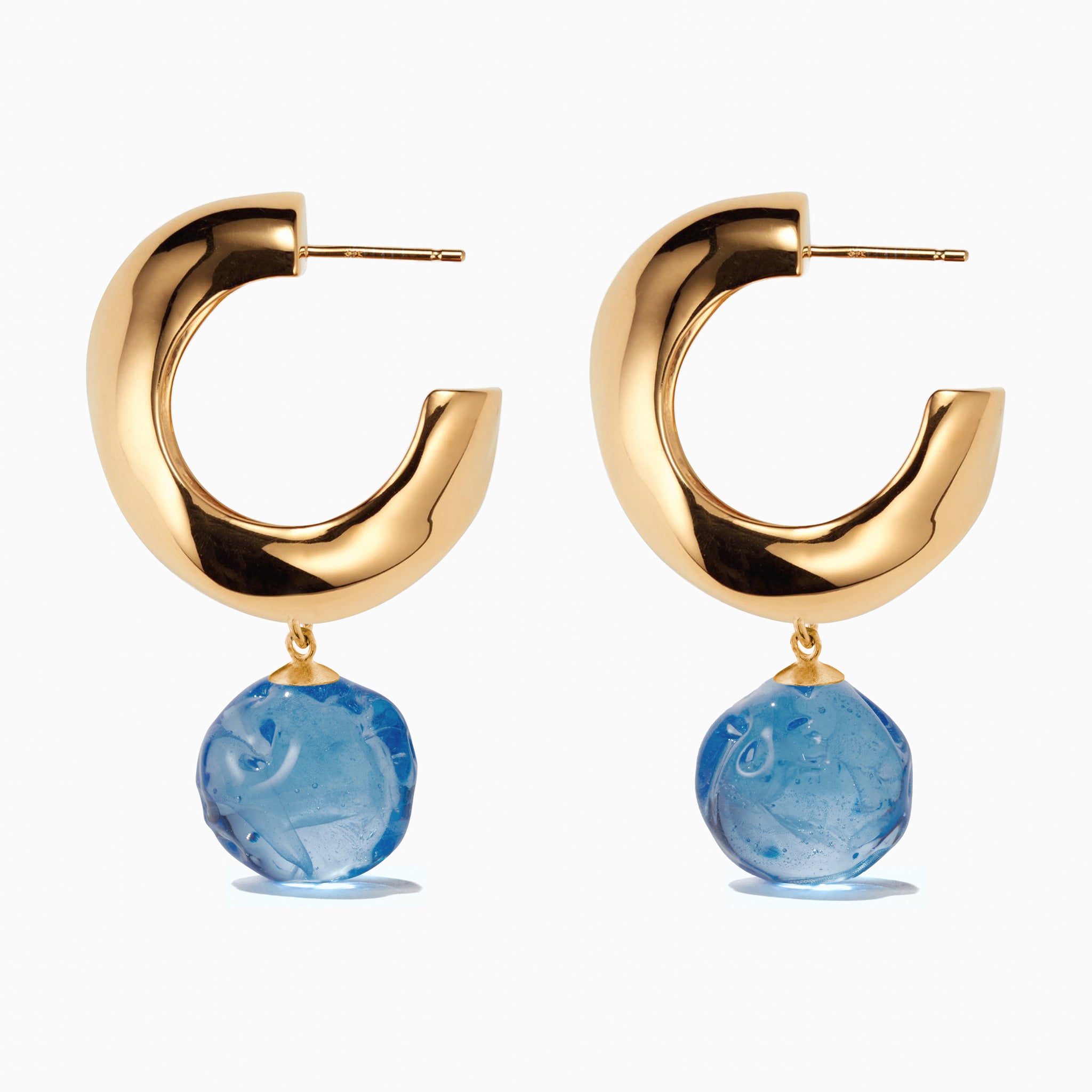 AGMES yellow gold vermeil medium Cleo hoop earrings with blue glass bead drop on white background.