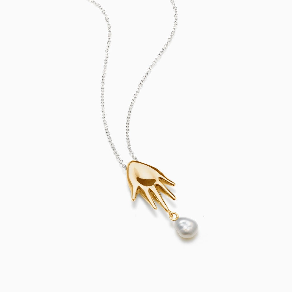 AGMES 18K Gold Vermeil mini lee abstract hand pendant with freshwater pearl drop. 