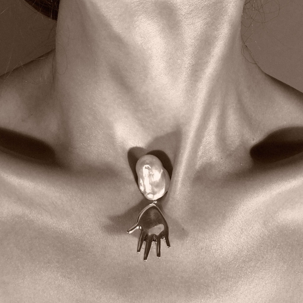 AGMES 0.925 sterling silver abstract hand earrings with baroque freshwater pearl drop.