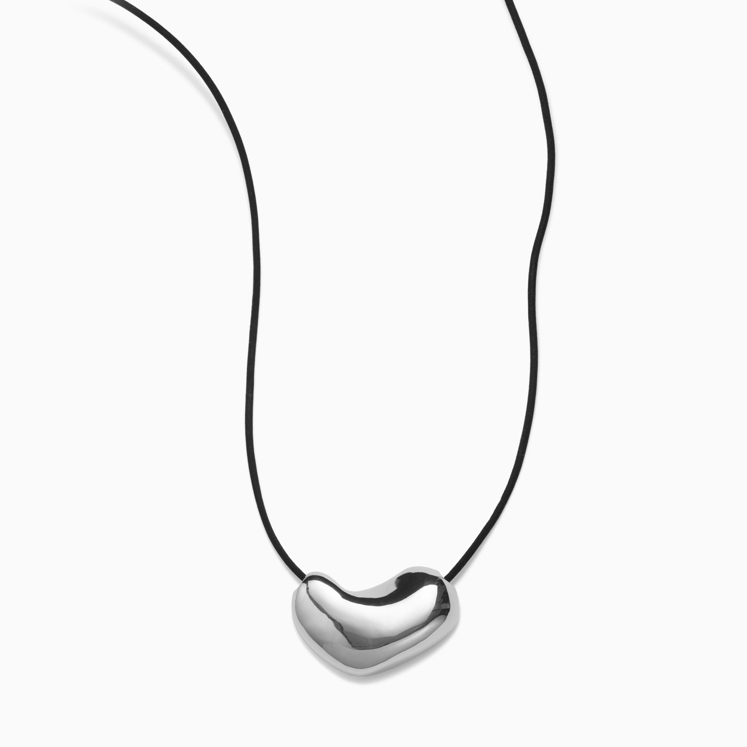 AGMES 0.925 sterling silver sculpted heart pendant on black suede cord.