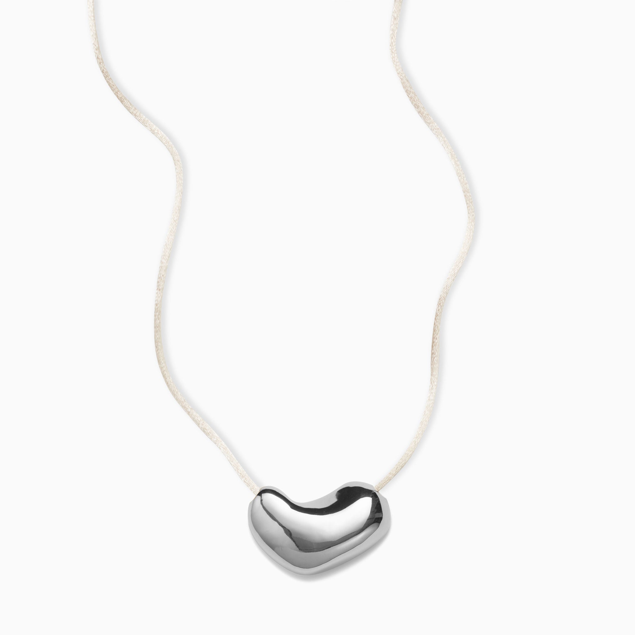 AGMES .925 Sterling Silver Sculpted Heart Pendant on Ivory Satin Cord.
