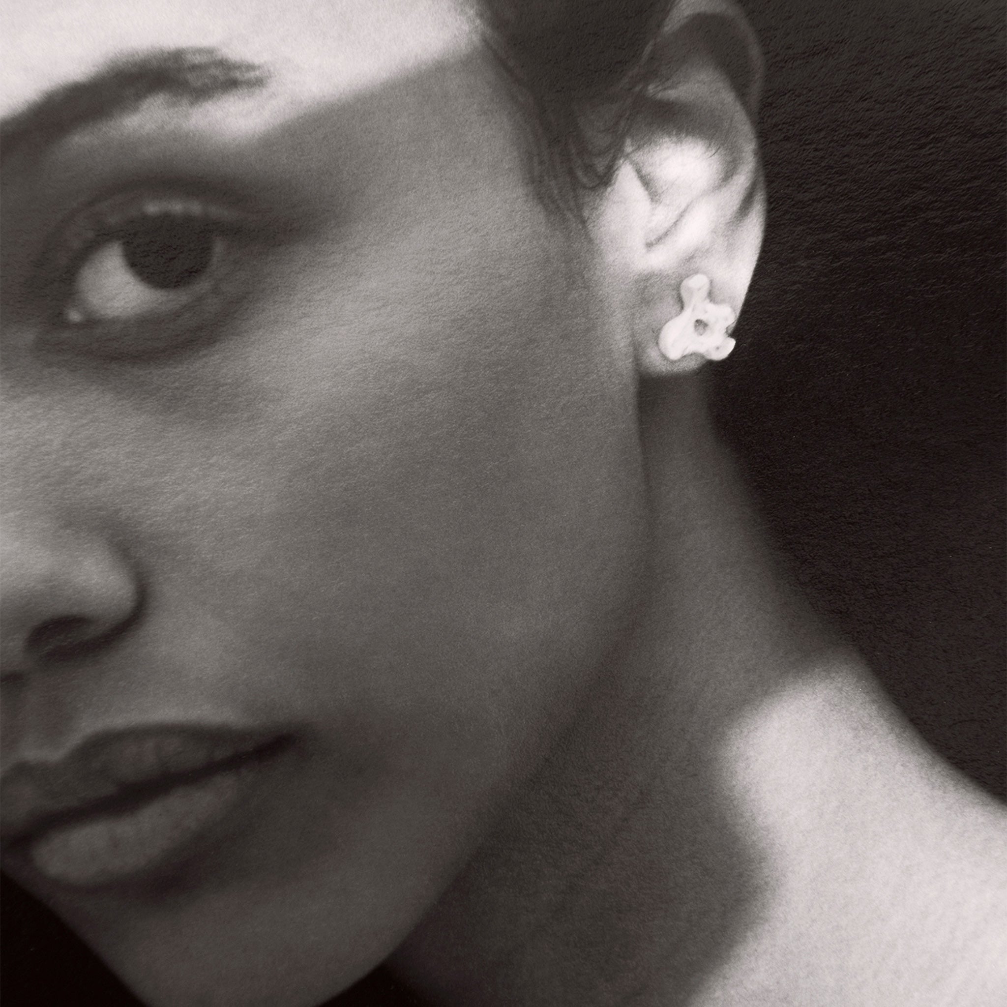 Woman wearing AGMES 0.925 sterling silver sculpted stud earrings. Simone Bodmer-Turner.