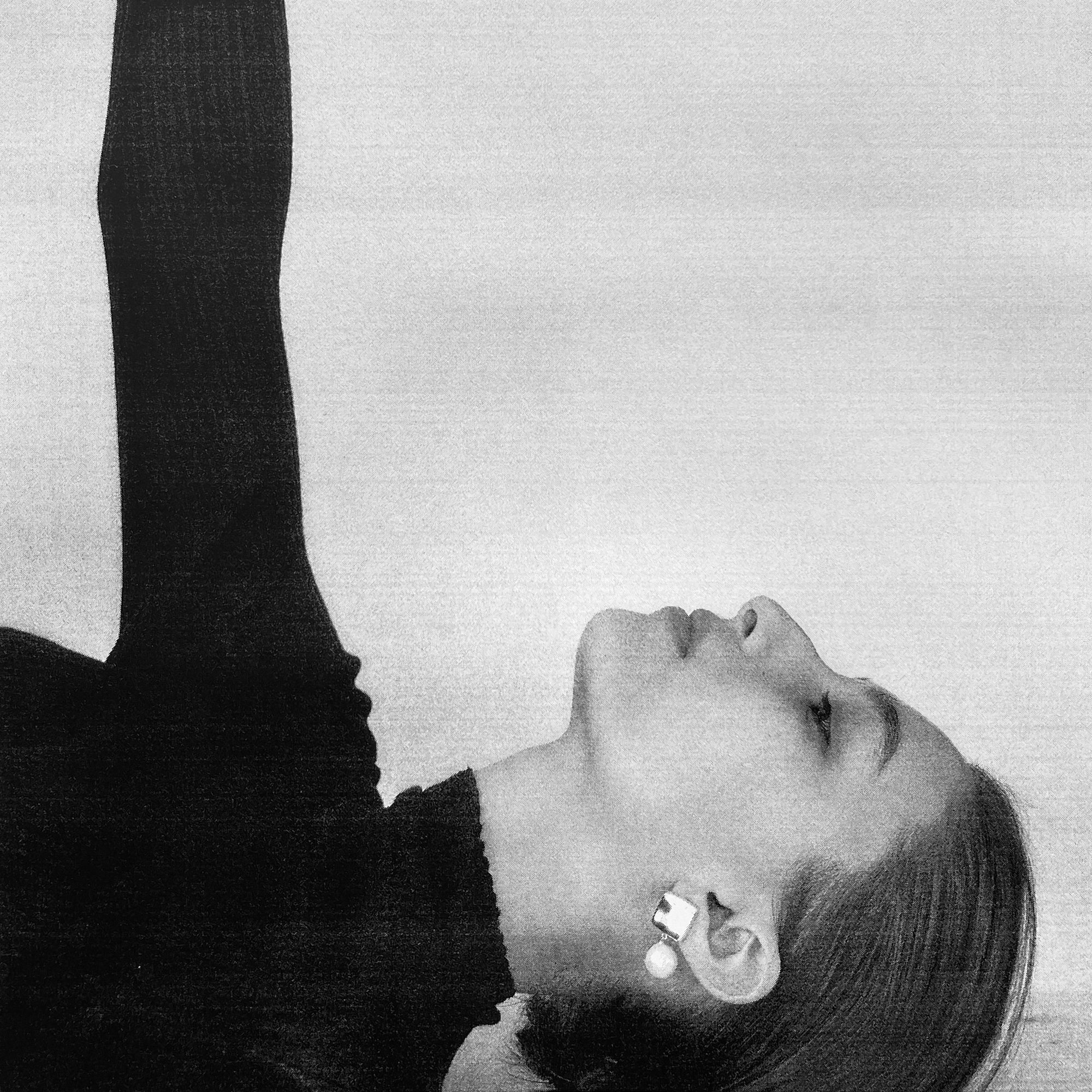 Woman wearing AGMES 0.925 sterling silver square shaped earrings with freshwater pearl drop.