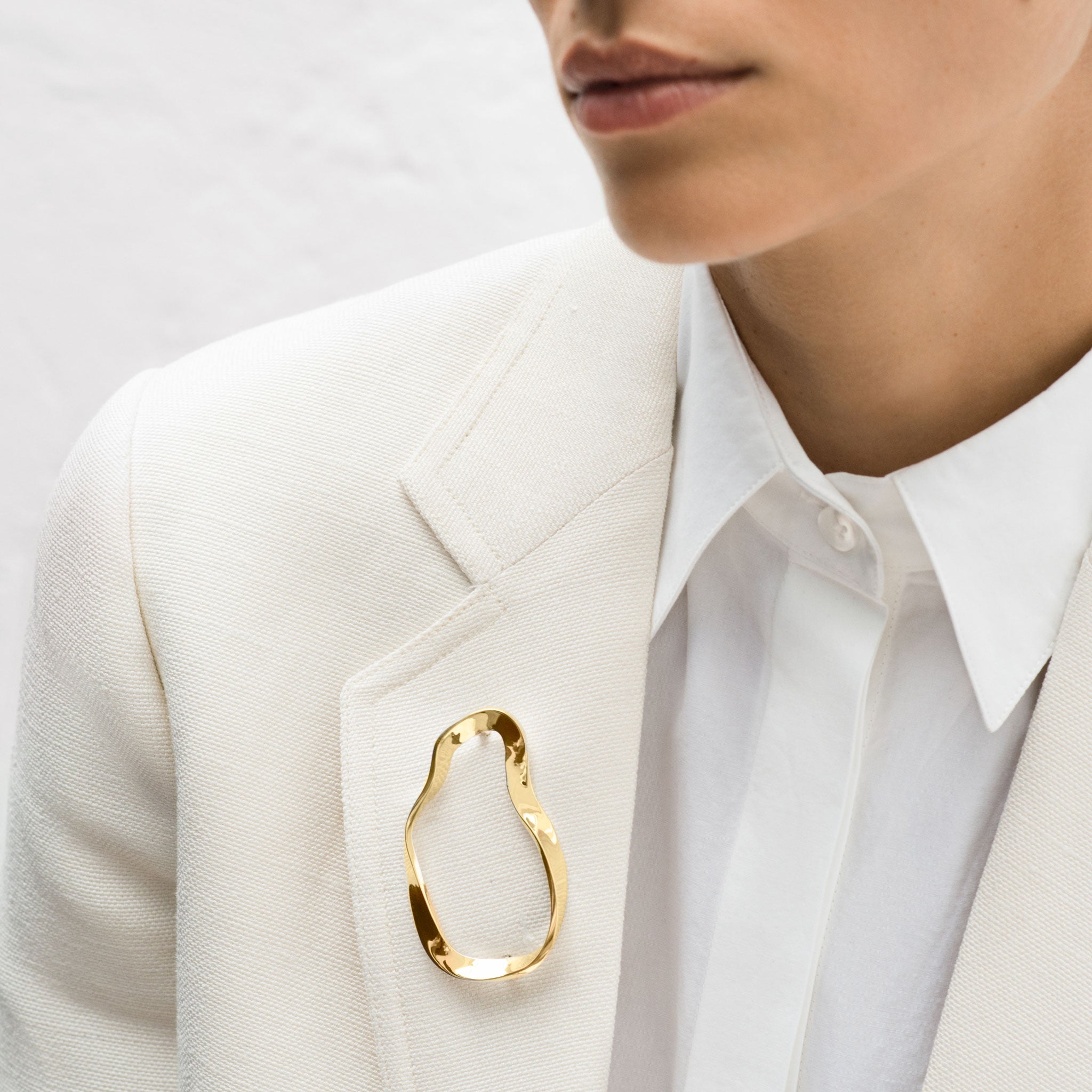 AGMES 18K Gold Vermeil Structural Vera Brooch displayed on clothing. 