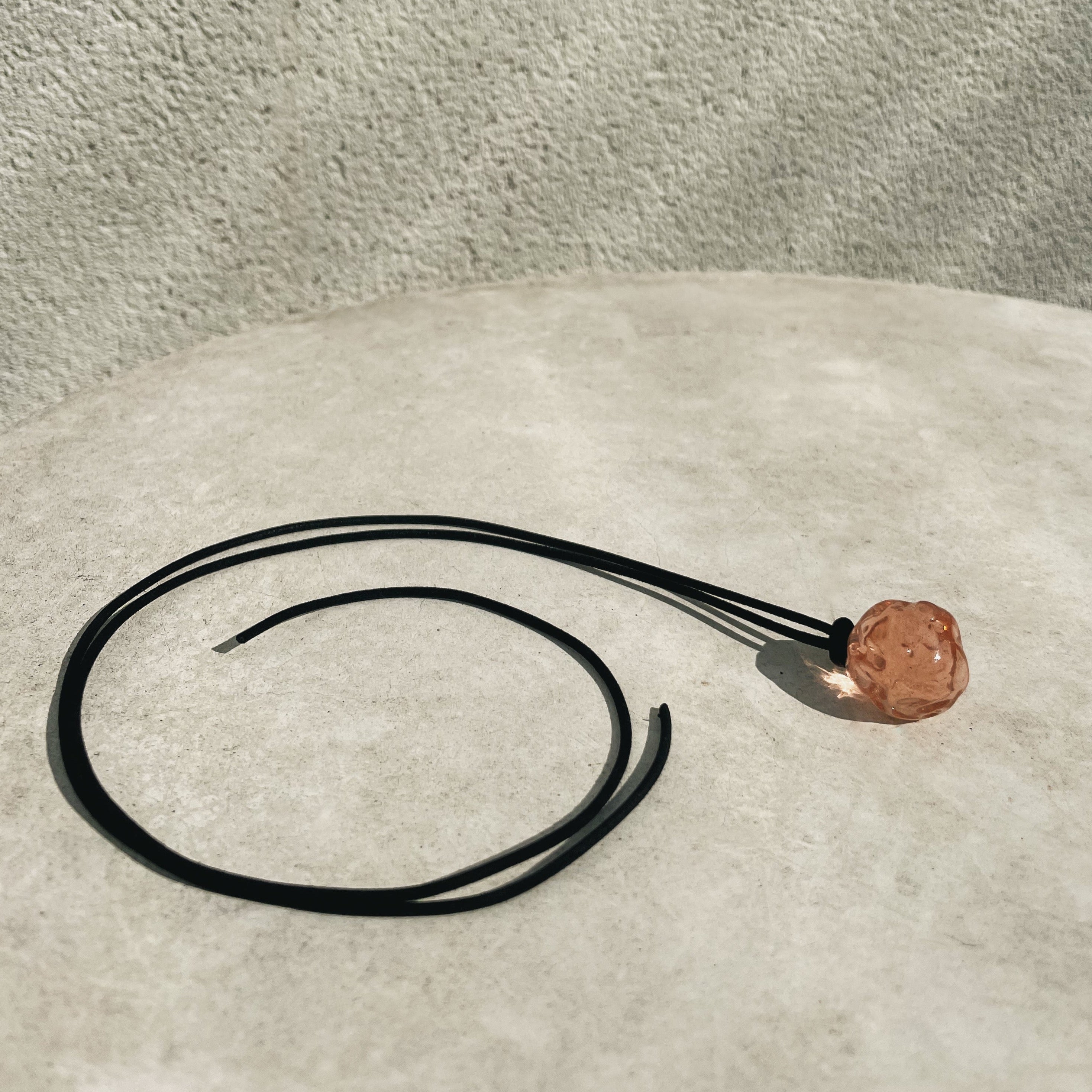 AGMES Rio Pendant Soda Lime Pink Glass Bead on black suede cord 