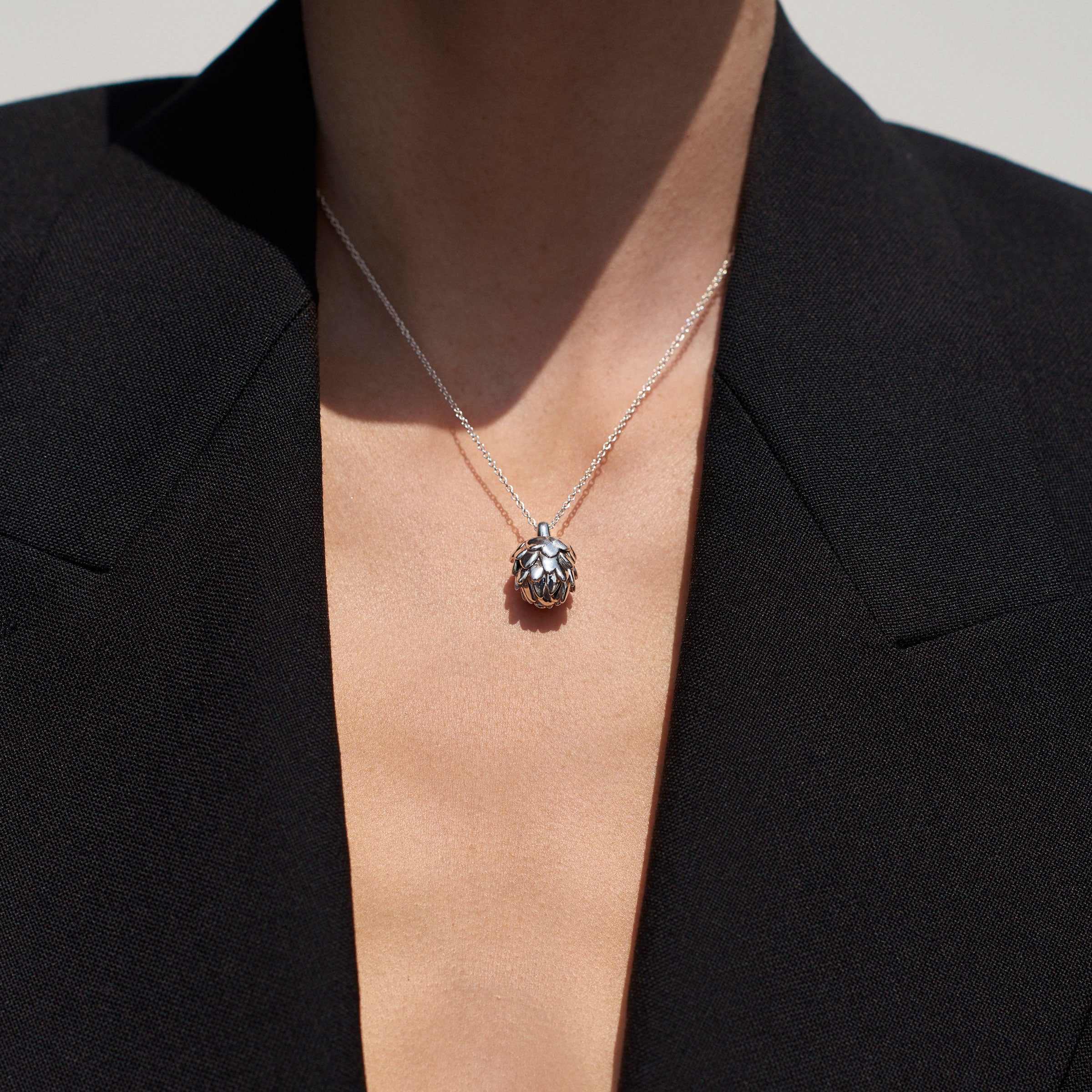 Person wearing AGMES 0.925 Sterling Silver Mini Artichoke Pendant Necklace 