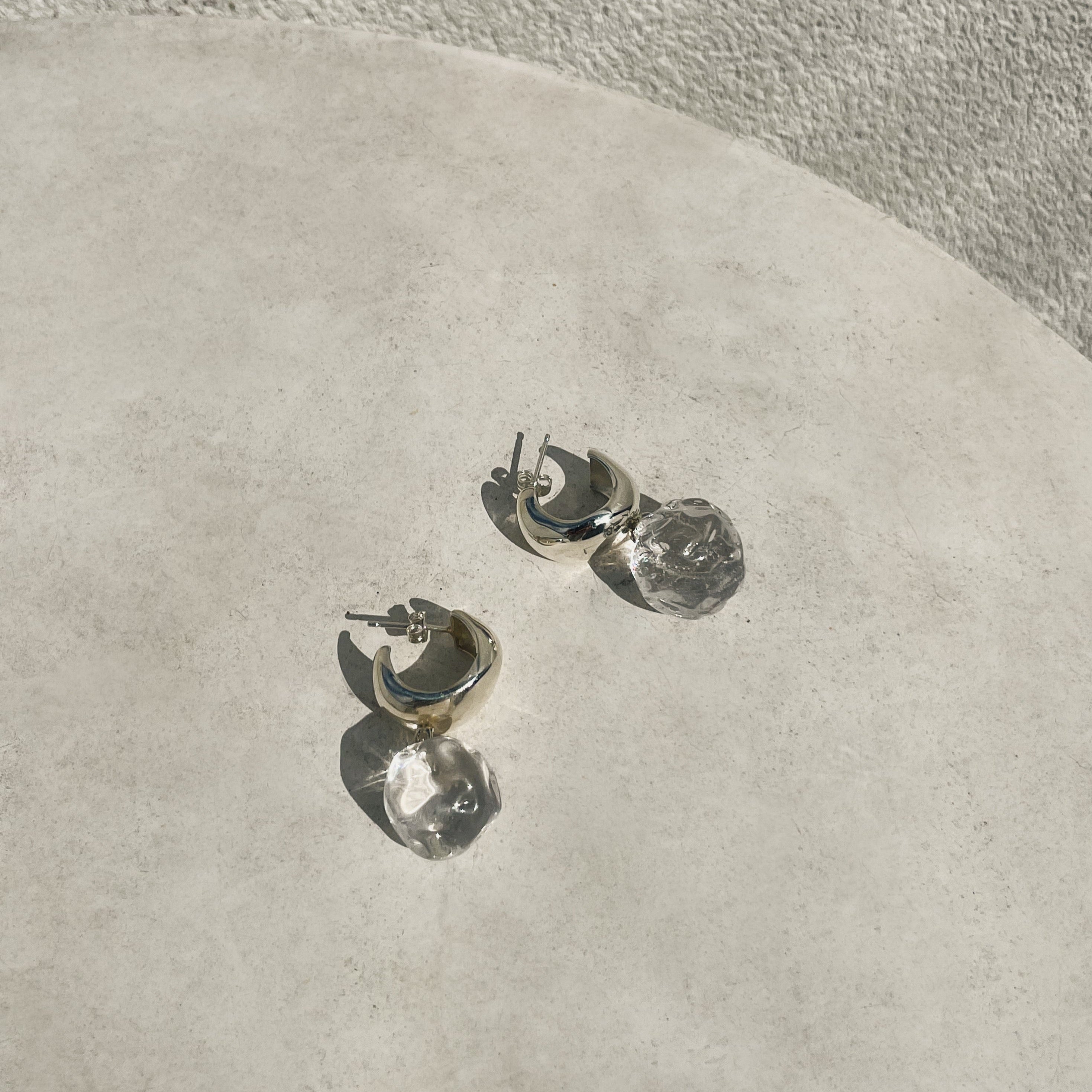 AGMES 0.925 sterling silver small Cleo hoop earrings with clear glass bead drop.