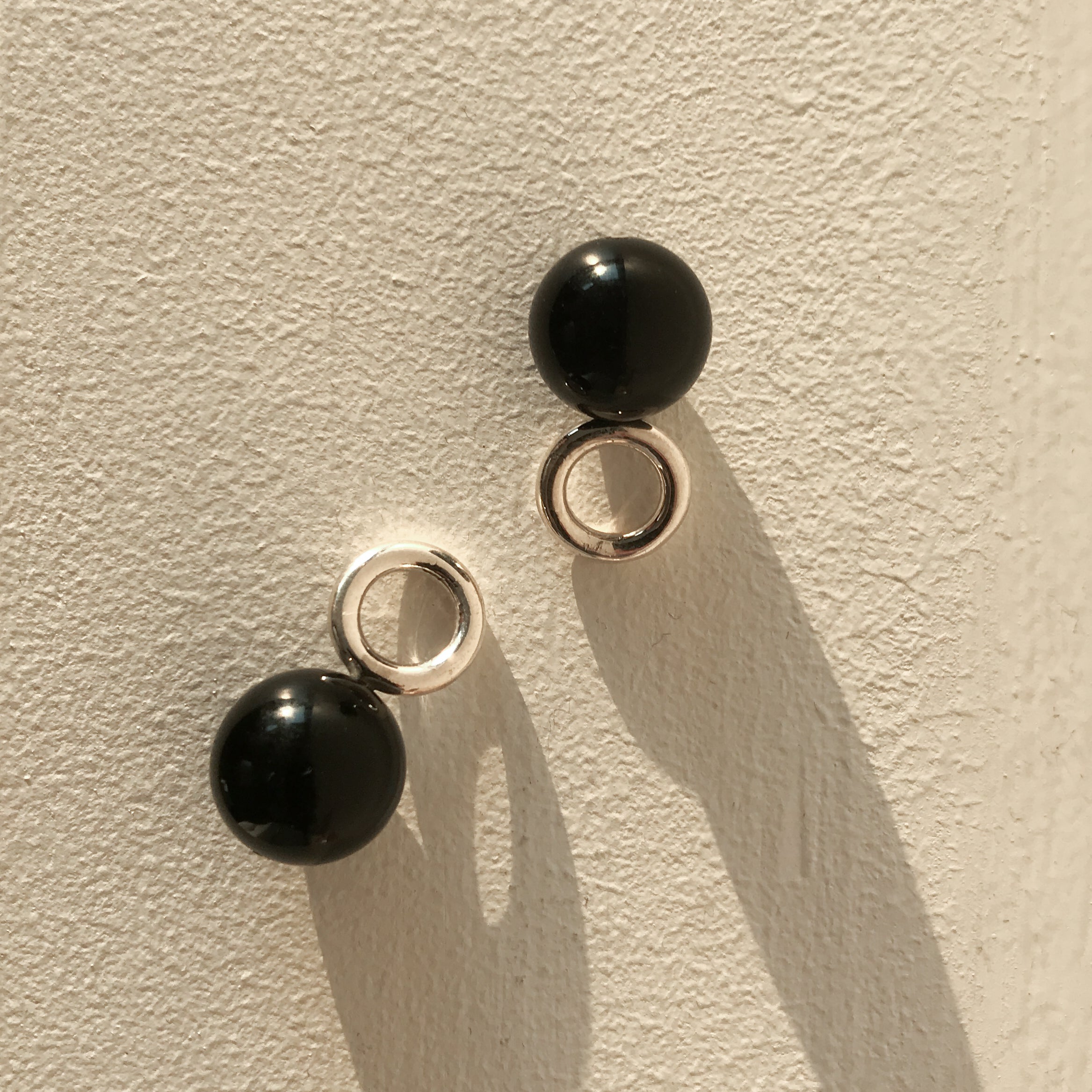 AGMES 0.925 sterling silver and onyx earring embellishment.