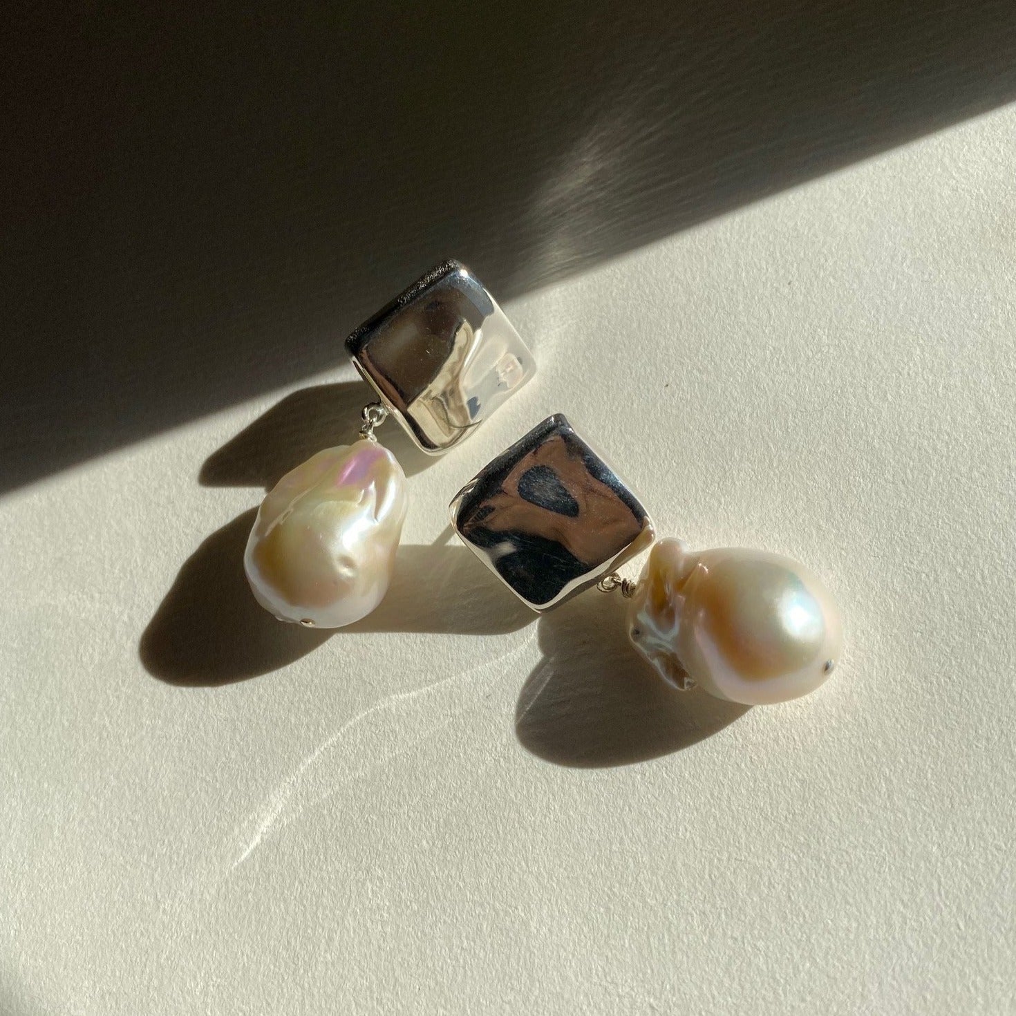 AGMES 0.925 sterling silver square shaped earrings with large baroque freshwater pearl drop.