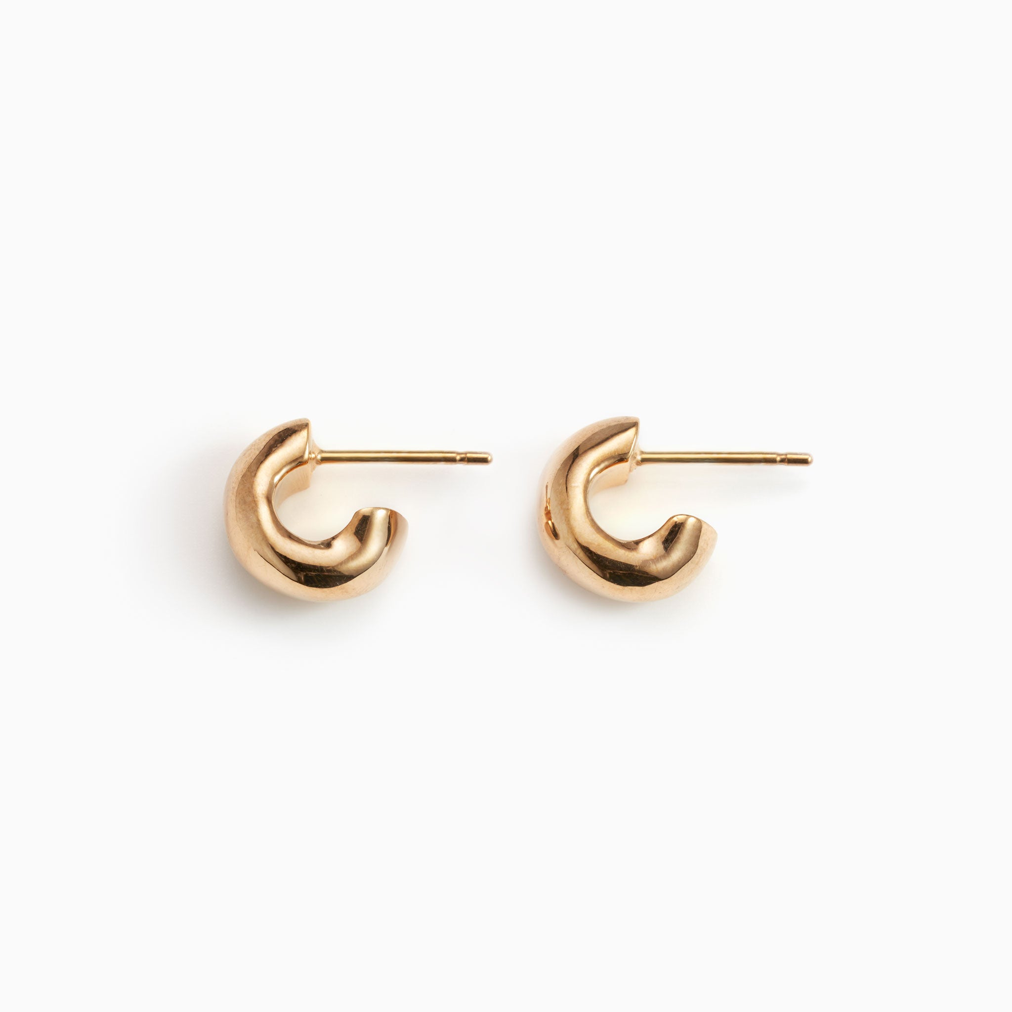 AGMES 18k gold vermeil thick hoop huggie earrings.