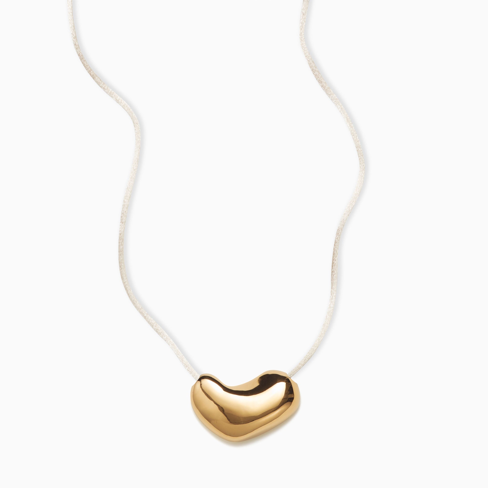 AGMES 18k Gold Vermeil sculpted heart pendant on ivory satin cord 