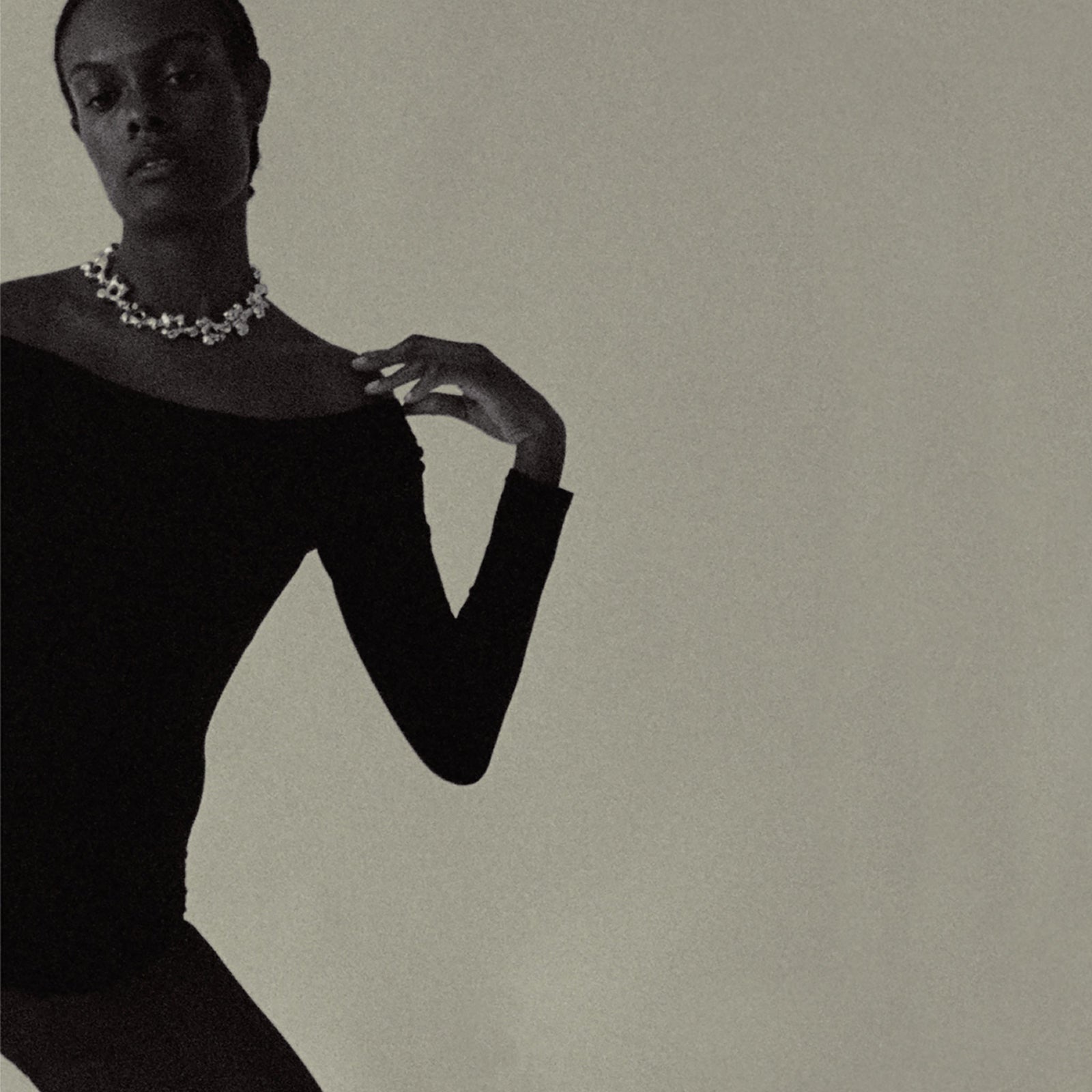 Model wearing AGMES .925 sterling silver sculptural collar Simone Necklace with black top.