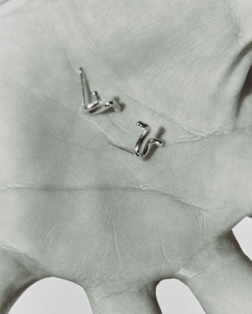 AGMES 0.925 sterling silver small twisted stud earrings.