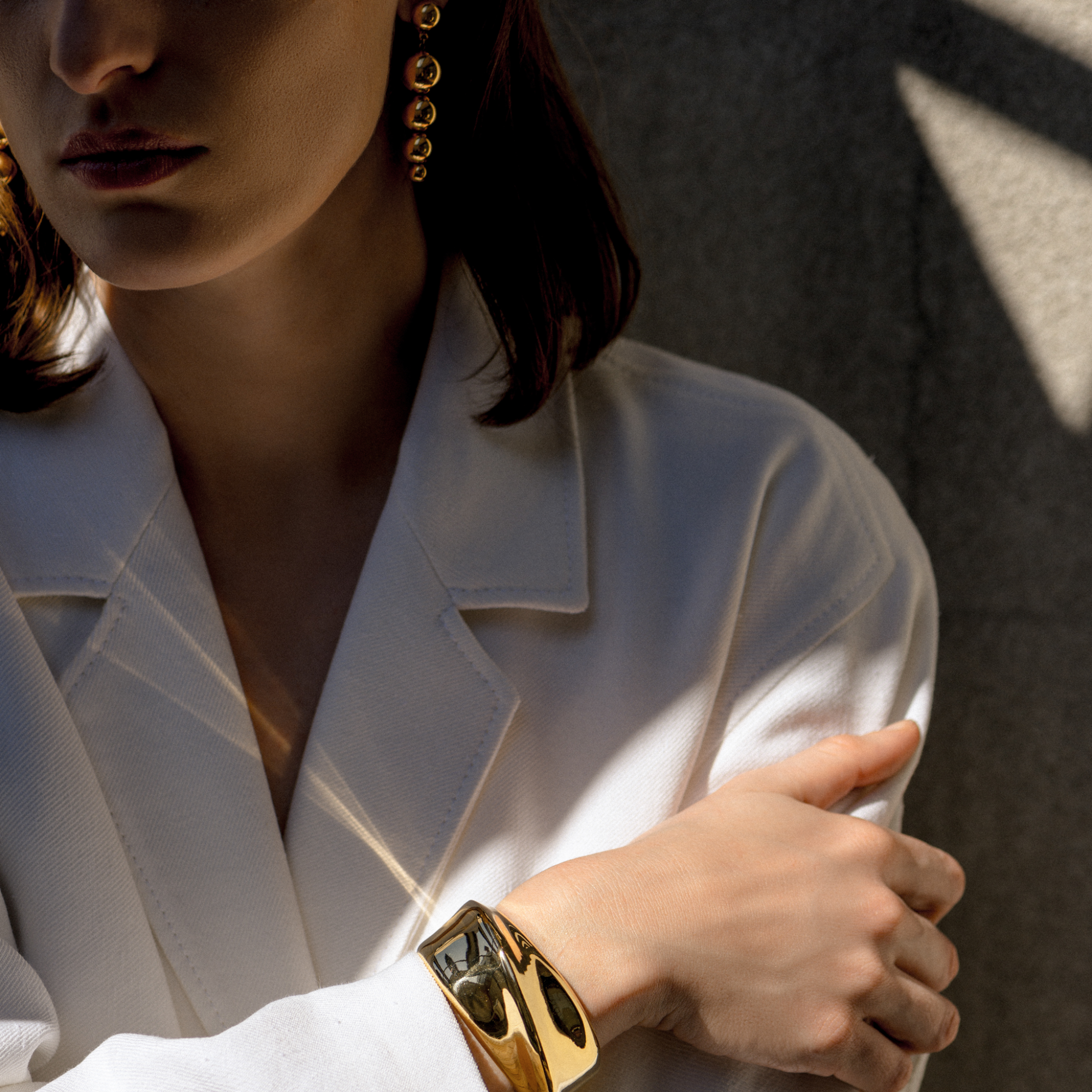 Woman wearing AGMES 18k Gold Vermeil Sculptural Twist Cuff 